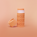 Load image into Gallery viewer, Noz vegan and reef safe sunscreen in the color orange.
